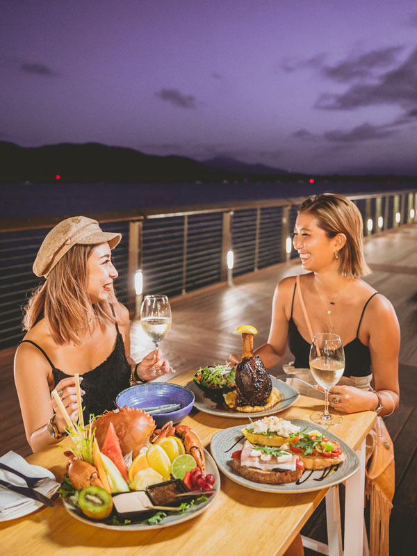two women dining at Dundee’s Waterfront Dining, Cairns restaurants