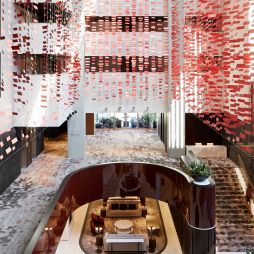 the three-storey Hotel Realm with red squares throughout