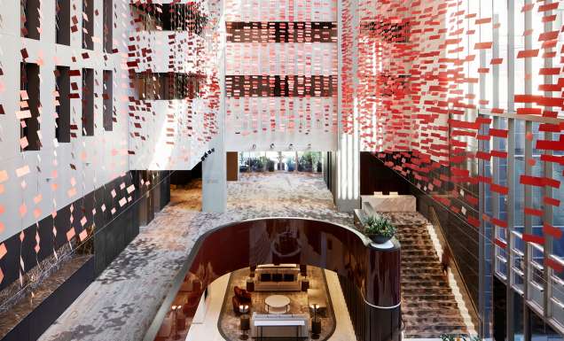 the three-storey Hotel Realm with red squares throughout