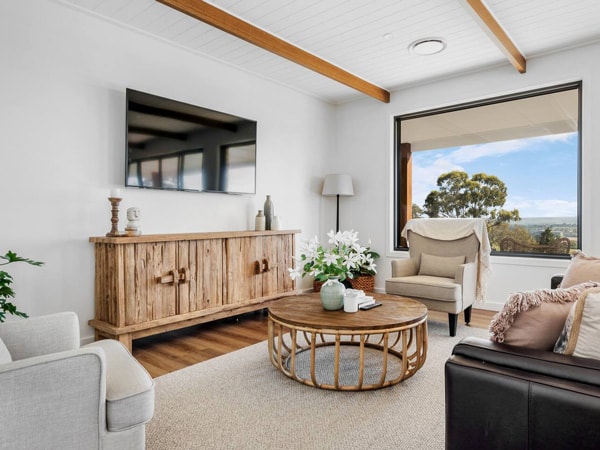 a modern living room with window at Avonview Cottage – Mount Panorama