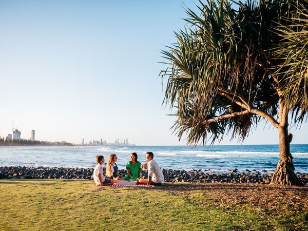 a family enjoying a picnic at Burleigh Hill, Gold Coast, Qld, instagrammable place in Australia