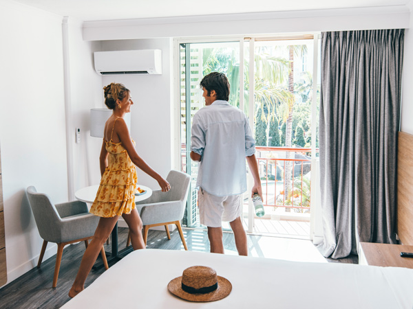 a couple inside their room at Novotel Cairns Oasis Resort