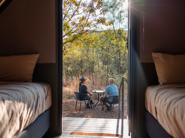 a couple outside a camping tent at El Questro Wilderness Park