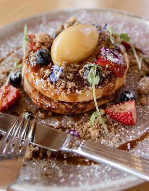 fluffy buttermilk pancakes on a plate at Goodfriends Eatery, Newcastle