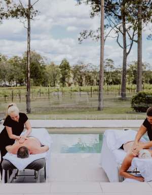 two people undergoing massage treatments by the pool at Nu Leaf Retreat, Hunter Valley