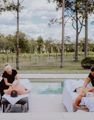 two people undergoing massage treatments by the pool at Nu Leaf Retreat, Hunter Valley