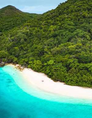 an aerial view of the turquoise waters of Nudey Beach