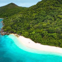 an aerial view of the turquoise waters of Nudey Beach
