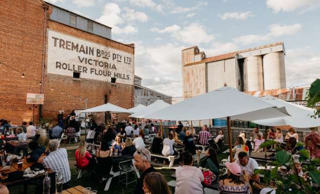 the Backyard and Tremains Mill filled with people dining at The Victoria pub, Bathurst