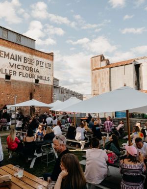 the Backyard and Tremains Mill filled with people dining at The Victoria pub, Bathurst
