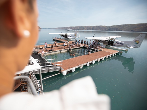 tourists swimming in the marine enclosure