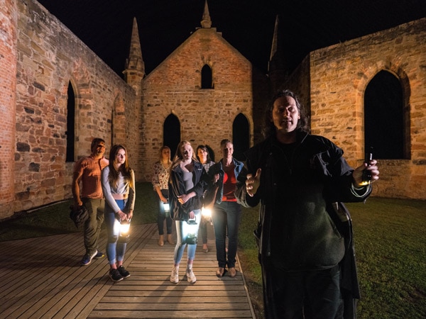 people holding lanterns on a guided ghost tour in Port Arthur