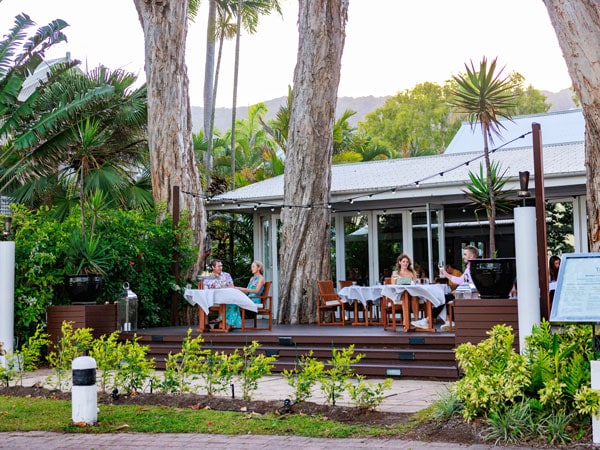 people dining on the al fresco deck at The Reef House Boutique Hotel and Spa, Cairns