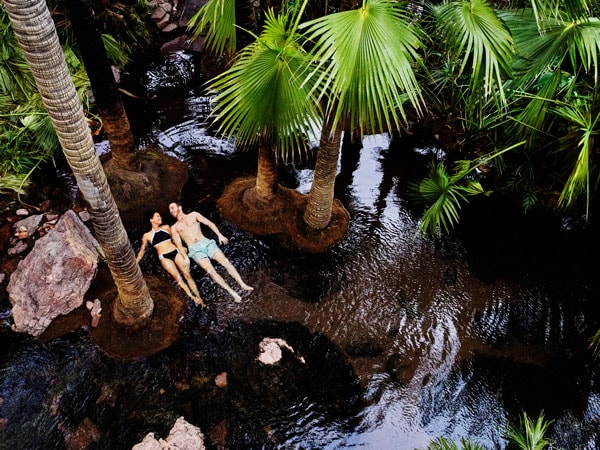 a couple floating on the Zebedee Springs