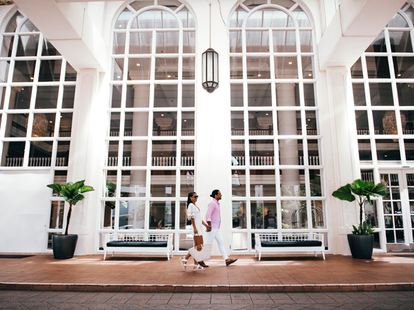 a couple walking inside Pullman Cairns International