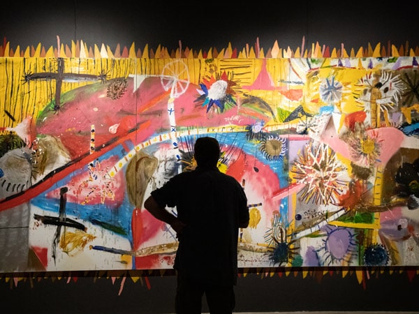 a man looking at a mural inside Northern Centre for Contemporary Art