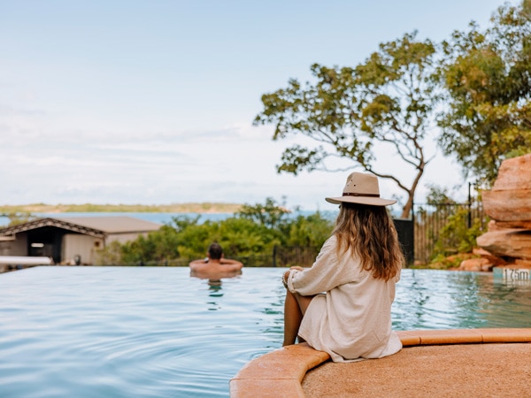a woman relaxing by the pool at Cygnet Bay Pearl Farm