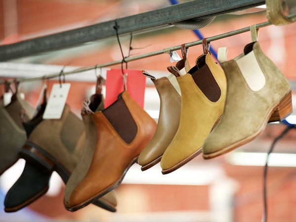 a variety of boot styles hang on display at R.M. Williams Factory in Adelaide