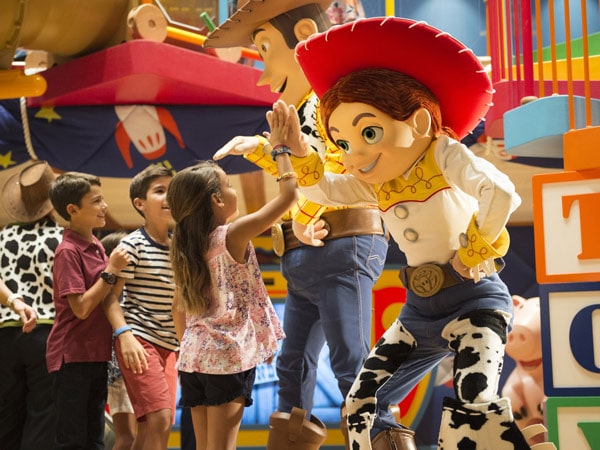 Kids playing with Toy Story characters in Andy's Room in Disney’s Oceaneer Club on Disney Wonder