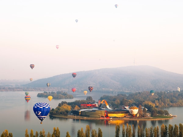 hot air balloons floating over Lake Burley Griffin, Canberra, Australian Capital Territory
