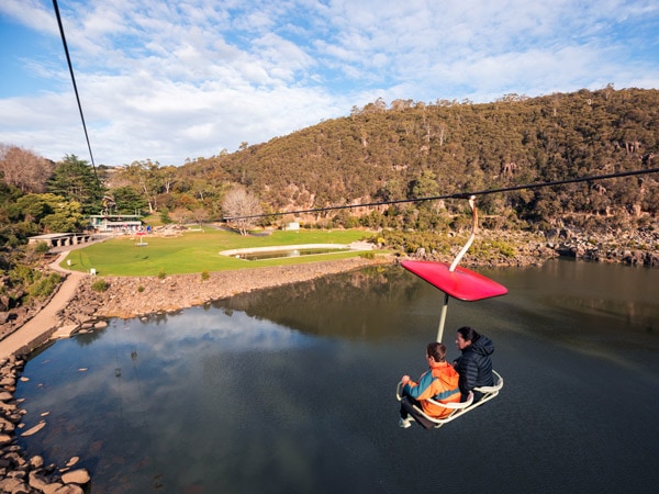 two people crossing the Cataract Gorge on the Gorge Scenic Chairlift in Launceston