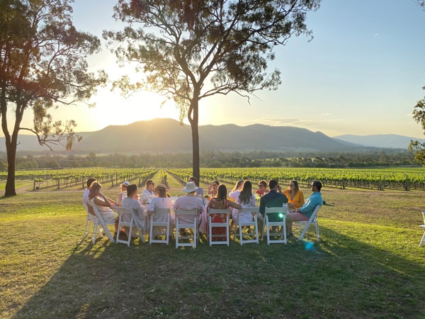 guests sipping chardonnay in the sun at Winmark Wines