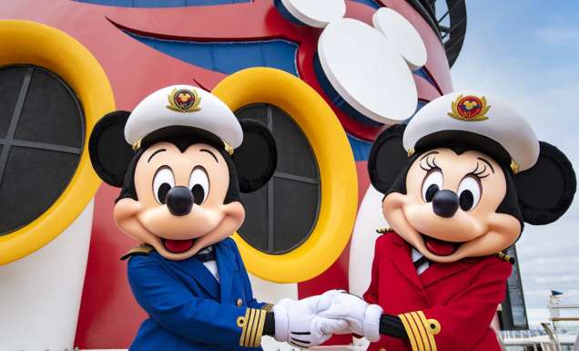 Captains Mickey Mouse and Minnie Mouse at funnel of Disney Wonder cruise ship