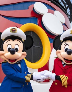Captains Mickey Mouse and Minnie Mouse at funnel of Disney Wonder cruise ship