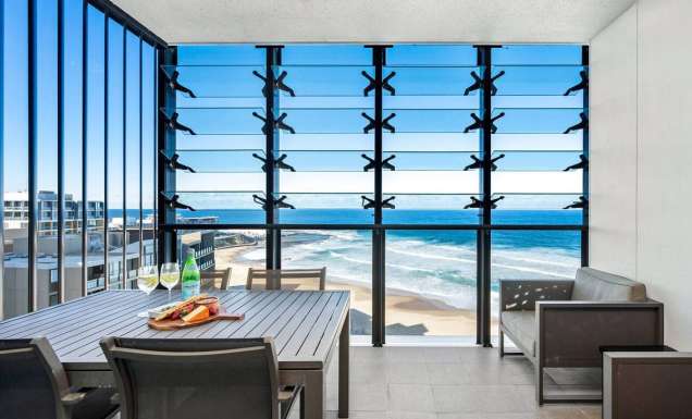 dining with views of Newcastle beach at Executive Beach Apartment