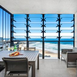 dining with views of Newcastle beach at Executive Beach Apartment