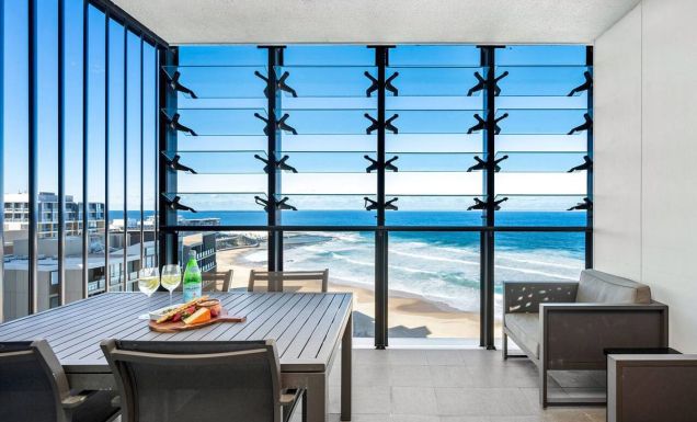 dining with views of Newcastle beach at Executive Beach Apartment
