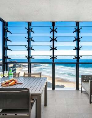 dining with views of Newcastle beach at Executive Beach Apartment