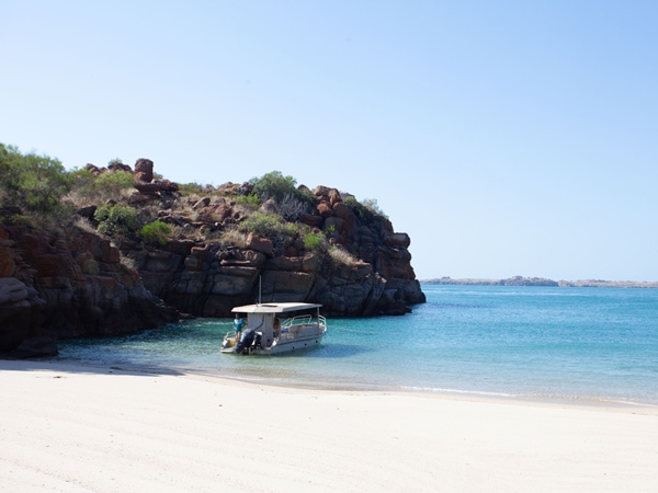a boat moored on the shore, Oolin Sunday Island Cultural Tours