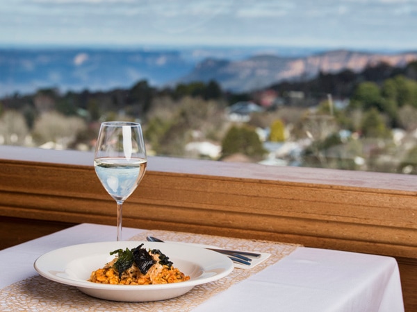 Views and plate of food and wine at Jamisons in the Blue Mountains