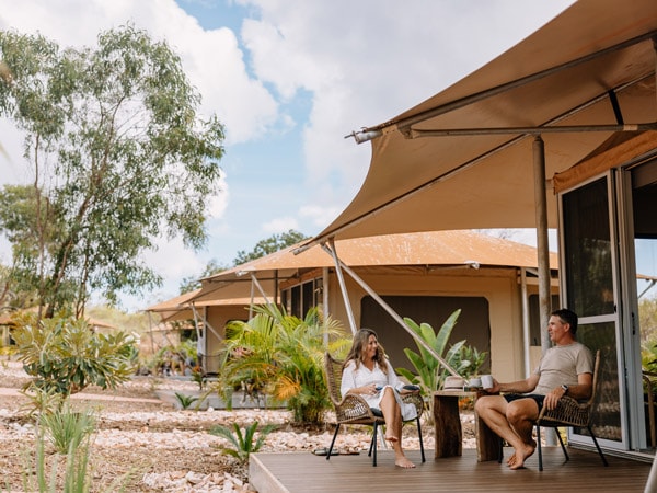 relaxing outside safari tents at Pearler’s Village