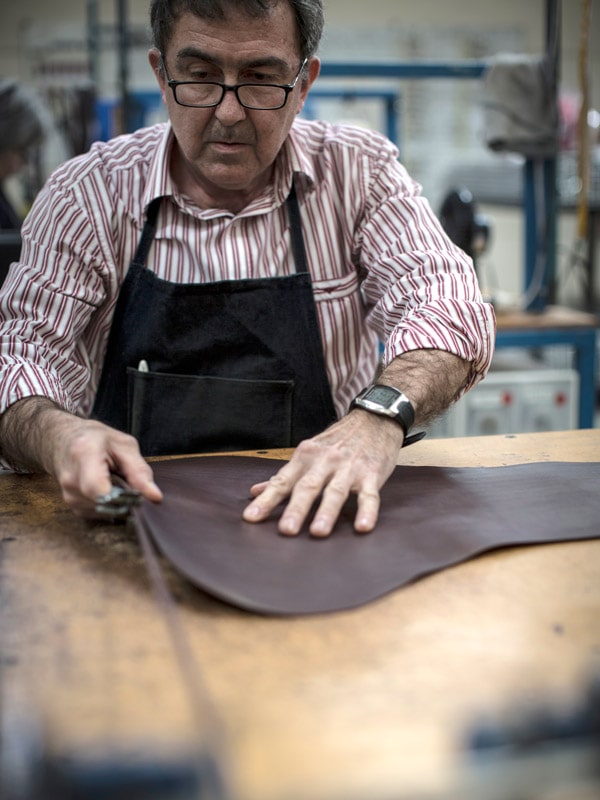 a craftsman shaping a boot at R.M. Williams Factory in Adelaide