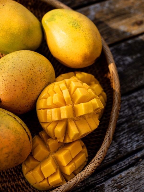 ripe mangoes in a basket