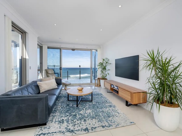 a room with balcony overlooking Newcastle beach at Seascape