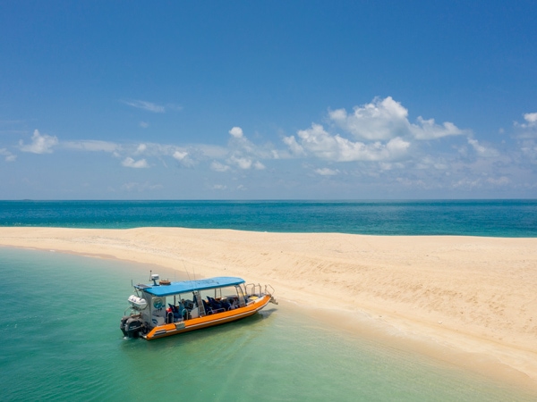 a boat moored in Banubanu Beach Retreat, NT’s East Arnhem Land