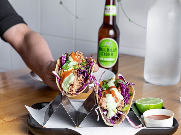 a person holding food at 8 Things, Katoomba