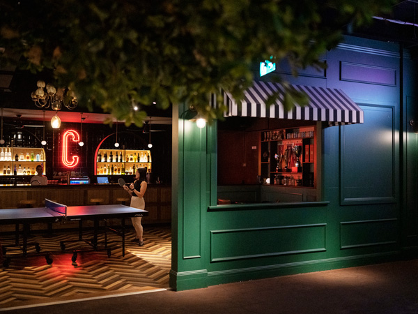 a woman playing table tennis at Ballers Clubhouse, Carlton