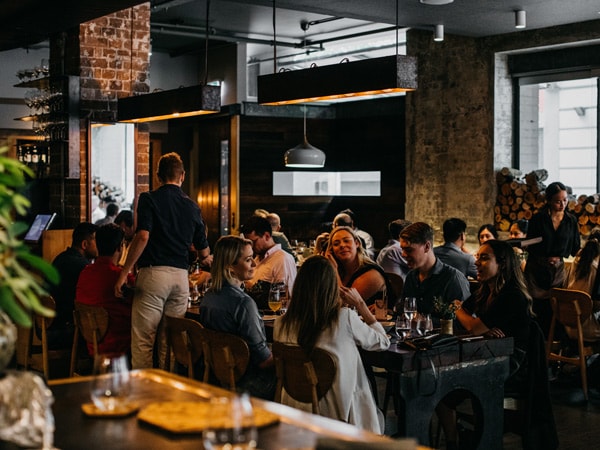 diners enjoying a meal at Surry Hill's Firedoor restaurant
