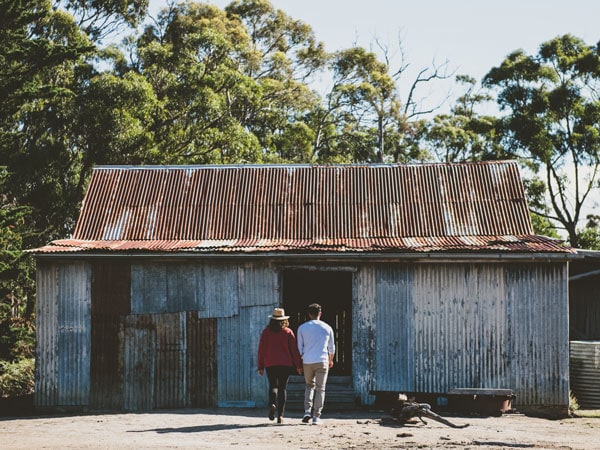a couple heading inside the French's Farm campsite, Tasmania