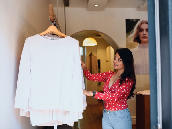 a woman browsing fashion at Sonia Hopkins store on William Street, Paddington