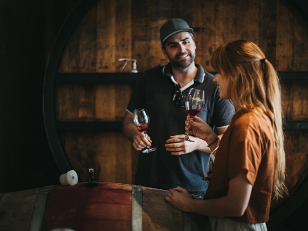 Man taking a woman through a tasting Pipers Brook Vineyard