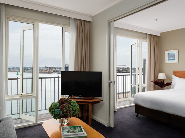 a suite with a balcony at Rydges Newcastle