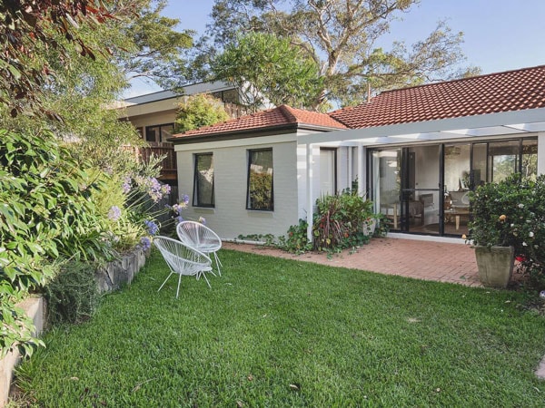 the garden fronting the property at Bellbird House Airbnb, Merimbula