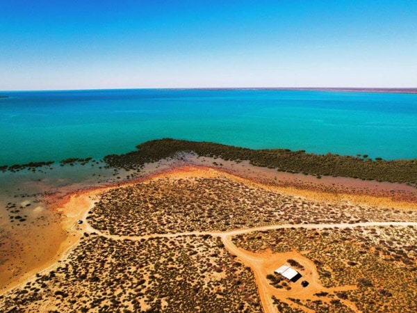 an aerial view of Bullara Station near the beach