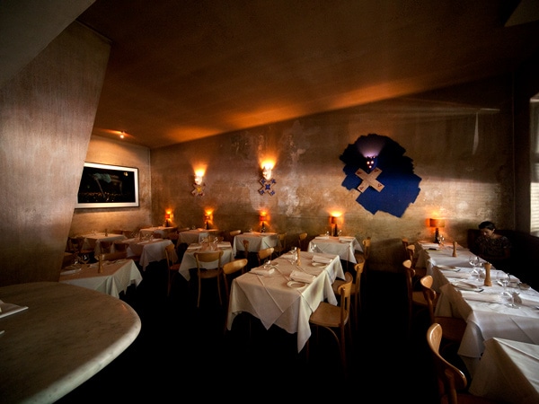 a dimly lit dining interior at Cafe Di Stasio