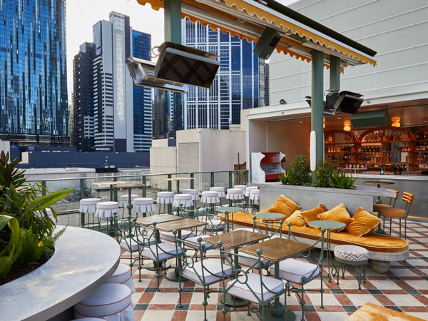 an al fresco seating area at Her Rooftop, CBD